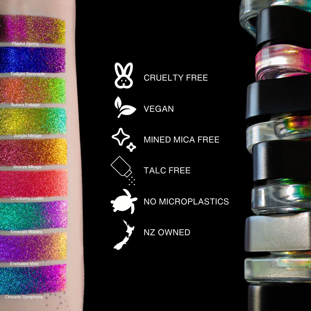 Multiple swatches of colorful, glittery shades are arranged side by side on a plain background.
