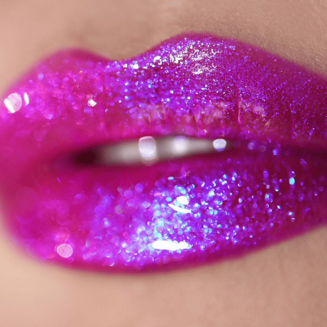 Lips with a glittery purple-pink ombre gloss shimmer under neon lighting
