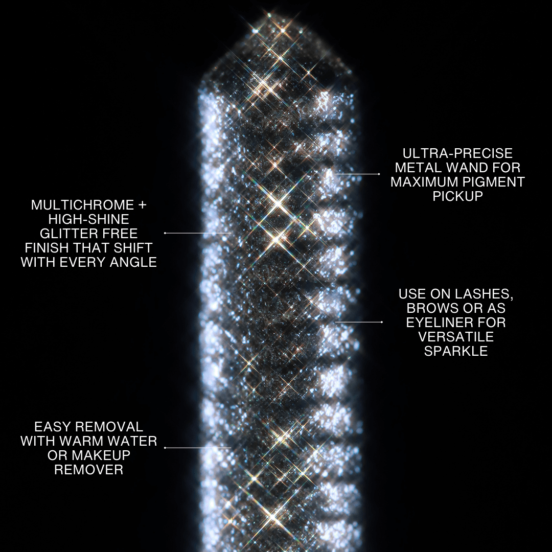 A multichrome glitter mascara wand with silver sparkles is displayed against a black background.