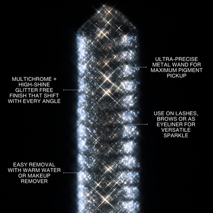 A multichrome glitter mascara wand with silver sparkles is displayed against a black background.