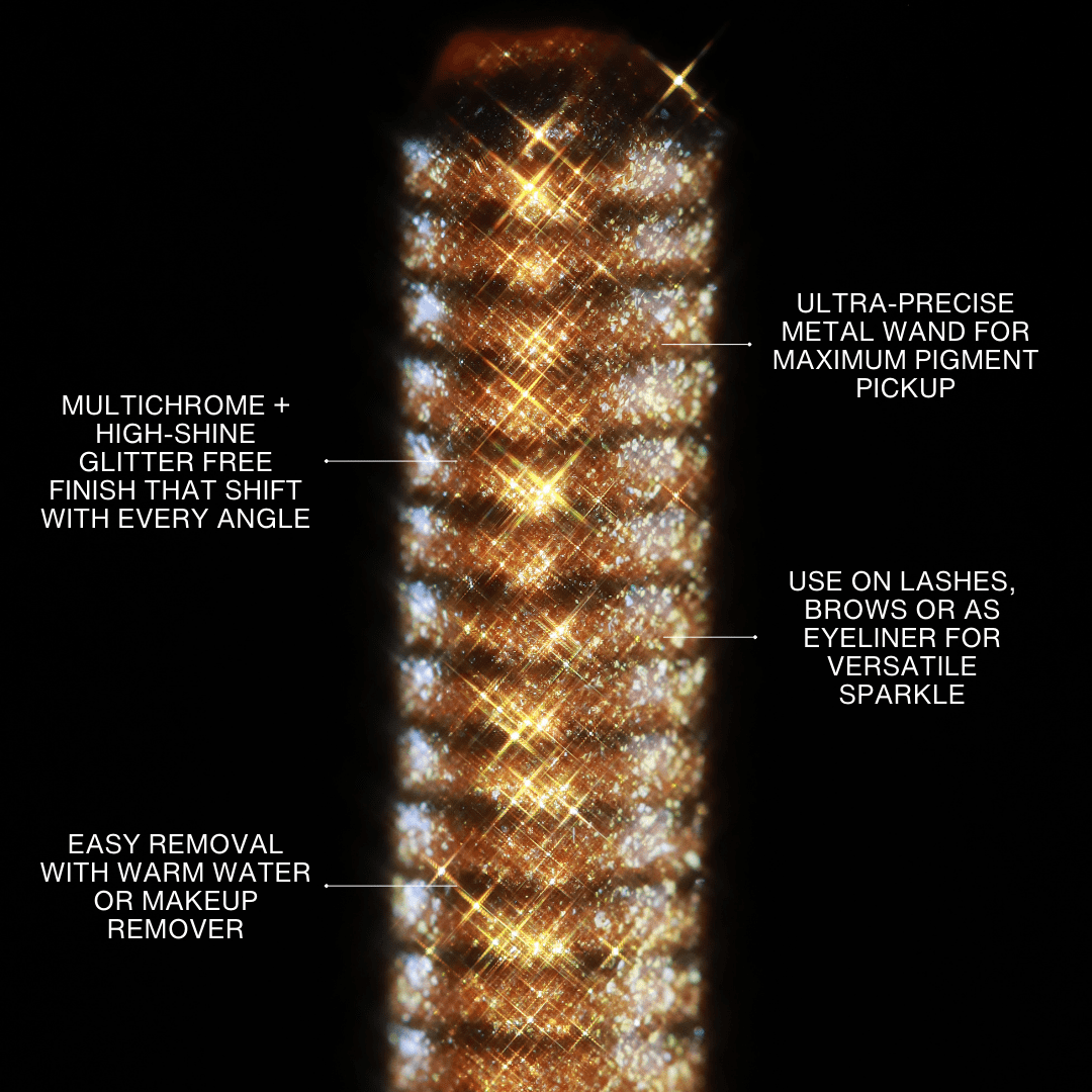 Close-up of a Sunlit Treasure mascara topper wand with multicolor glitter and visible labeled features.