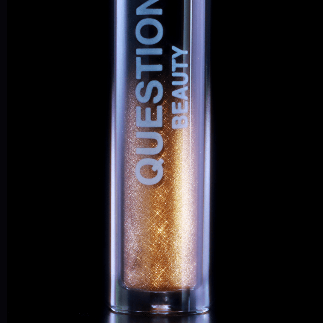 Close-up of gold mascara tube labeled QUESTION BEAUTY on the packaging.